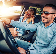 happy couple in new car