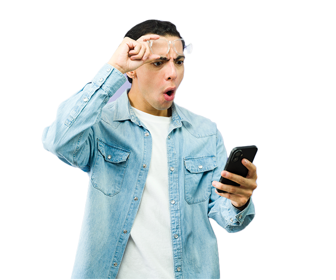 Concerned man lifting glasses and looking at phone